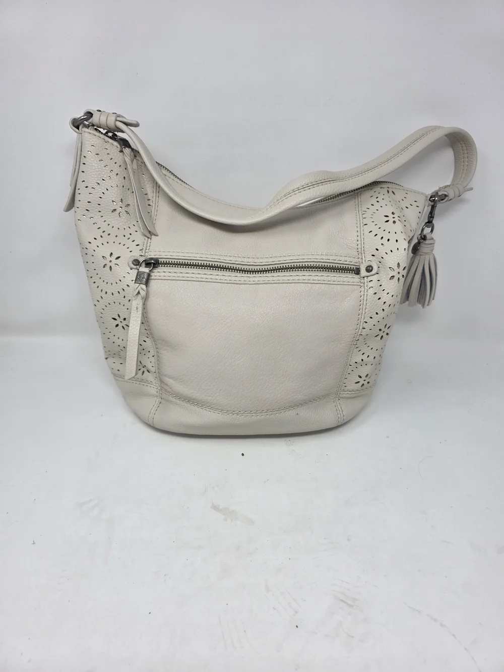 ​The Sak Off White Pebbled Leather Hobo Bag Perforated Cutout Tassel